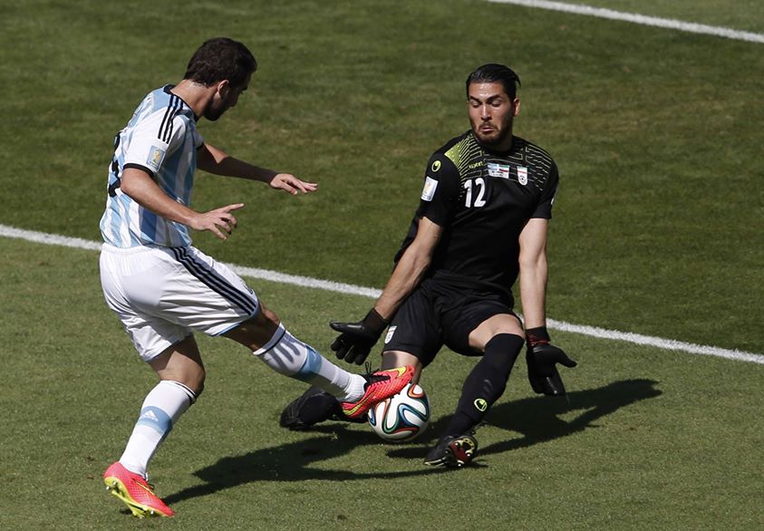 argentinas-gonzalo-higuain-fails-to-get-the-ball-past-irans-goalkeeper-alireza-haqiqi
